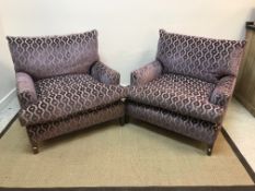 A pair of modern mauve medallion on beige and blue stripe upholstered armchairs on square tapered