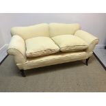 A Victorian yellow upholstered scroll arm drop end sofa on turned legs to castors