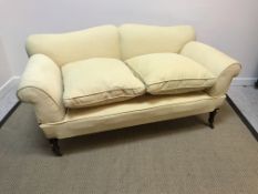 A Victorian yellow upholstered scroll arm drop end sofa on turned legs to castors