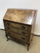 A mid 20th Century burr walnut and cross-banded bureau,