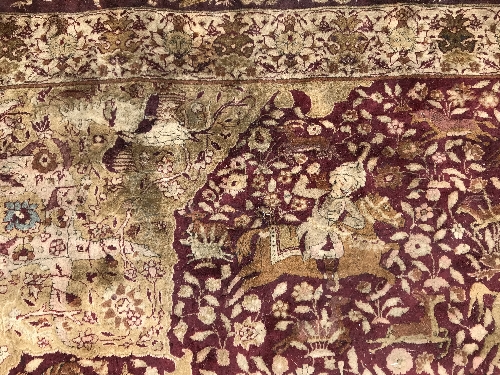 An early 20th Century Agra North India carpet with centre medallion on a wine-coloured ground, - Image 24 of 103