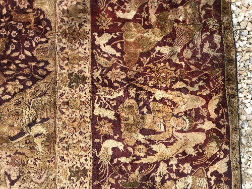 An early 20th Century Agra North India carpet with centre medallion on a wine-coloured ground, - Image 70 of 103