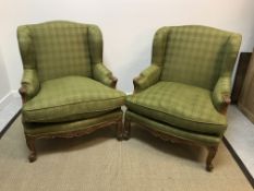 A pair of circa 1900 stained beech-framed wing back show frame armchairs in the Louis XV taste,