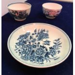 An 18th Century Worcester blue and white saucer decorated with two birds in flight and fence