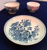 An 18th Century Worcester blue and white saucer decorated with two birds in flight and fence