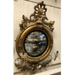 An early 19th Century carved giltwood and gesso framed girandole mirror,