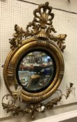 An early 19th Century carved giltwood and gesso framed girandole mirror,