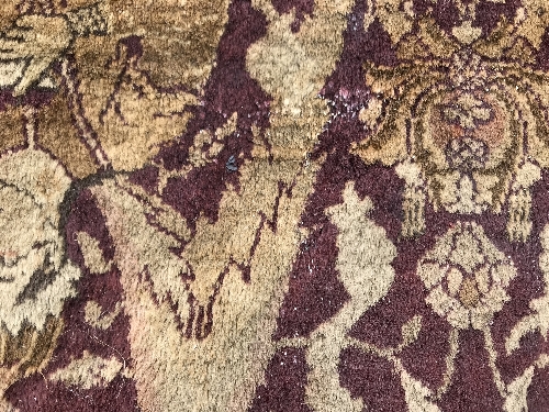 An early 20th Century Agra North India carpet with centre medallion on a wine-coloured ground, - Image 86 of 103