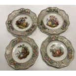 A pair of Continental ribbon plates, each decorated with courting couples to the centre, 24.