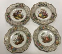 A pair of Continental ribbon plates, each decorated with courting couples to the centre, 24.