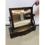 A 19th Century mahogany toilet mirror,