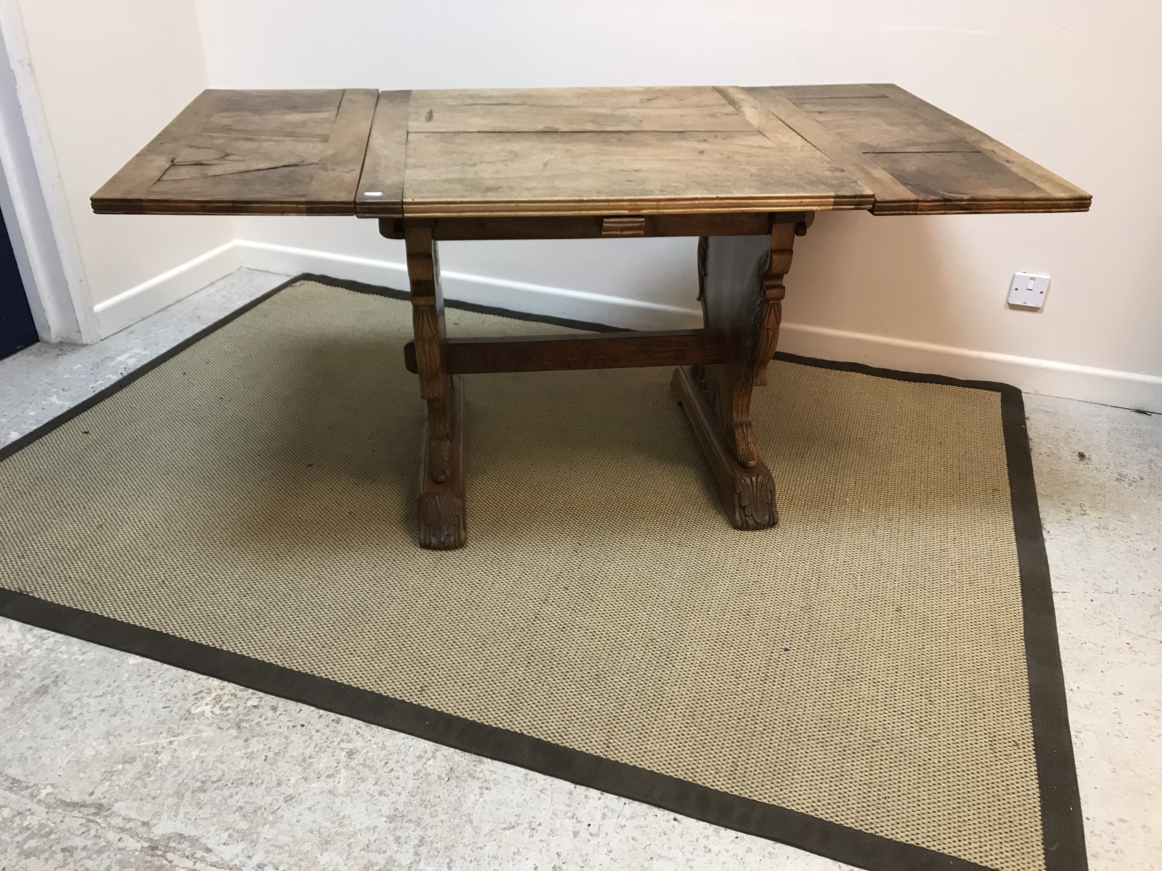 An early 20th Century walnut draw leaf extending dining table, - Image 2 of 2