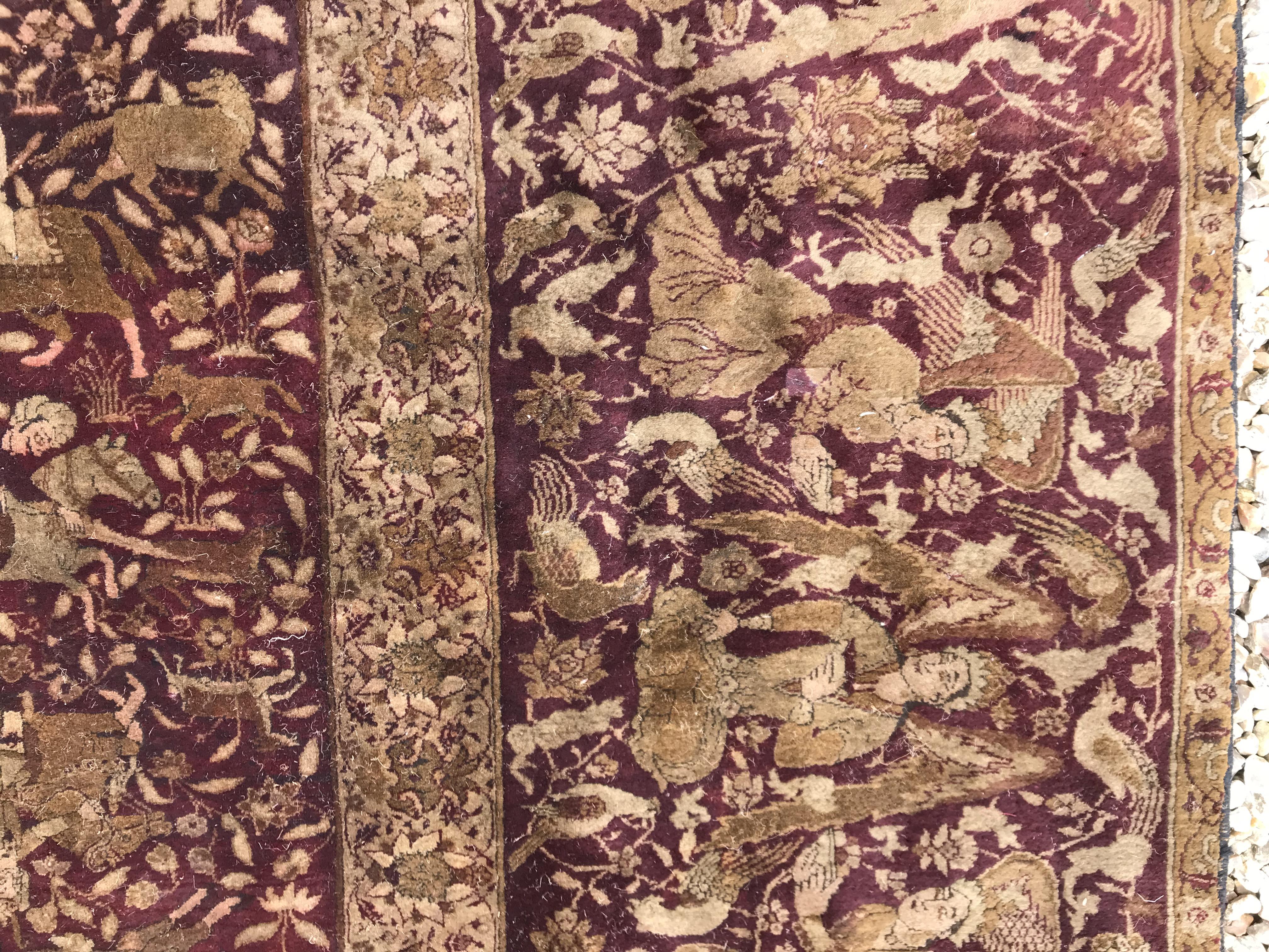 An early 20th Century Agra North India carpet with centre medallion on a wine-coloured ground, - Image 50 of 103