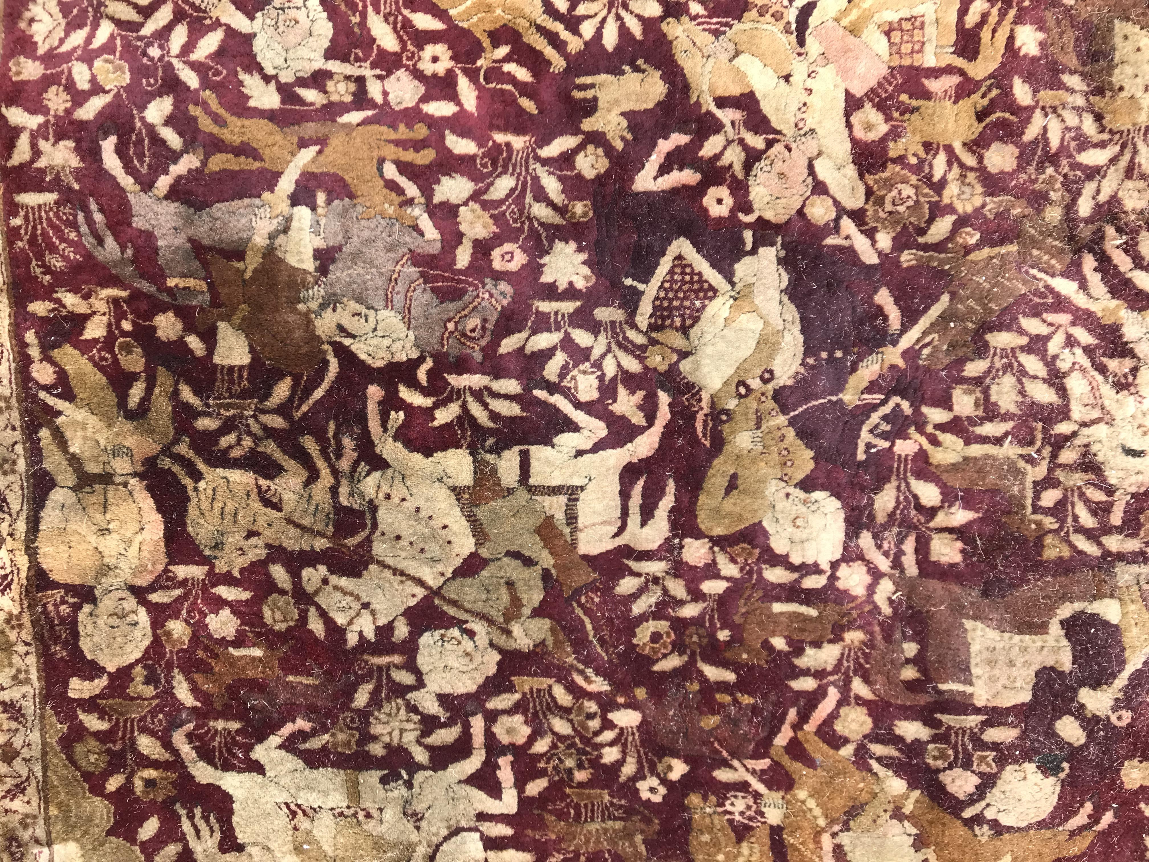 An early 20th Century Agra North India carpet with centre medallion on a wine-coloured ground, - Image 34 of 103