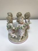 A Continental jardinere/pot decorated with dancing children wearing floral spray,