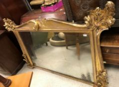 A Victorian carved giltwood and gesso framed overmantel mirror,