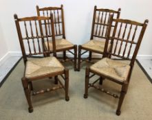 A set of four 20th Century oak rush seat spindle back dining chairs in the 19th Century North