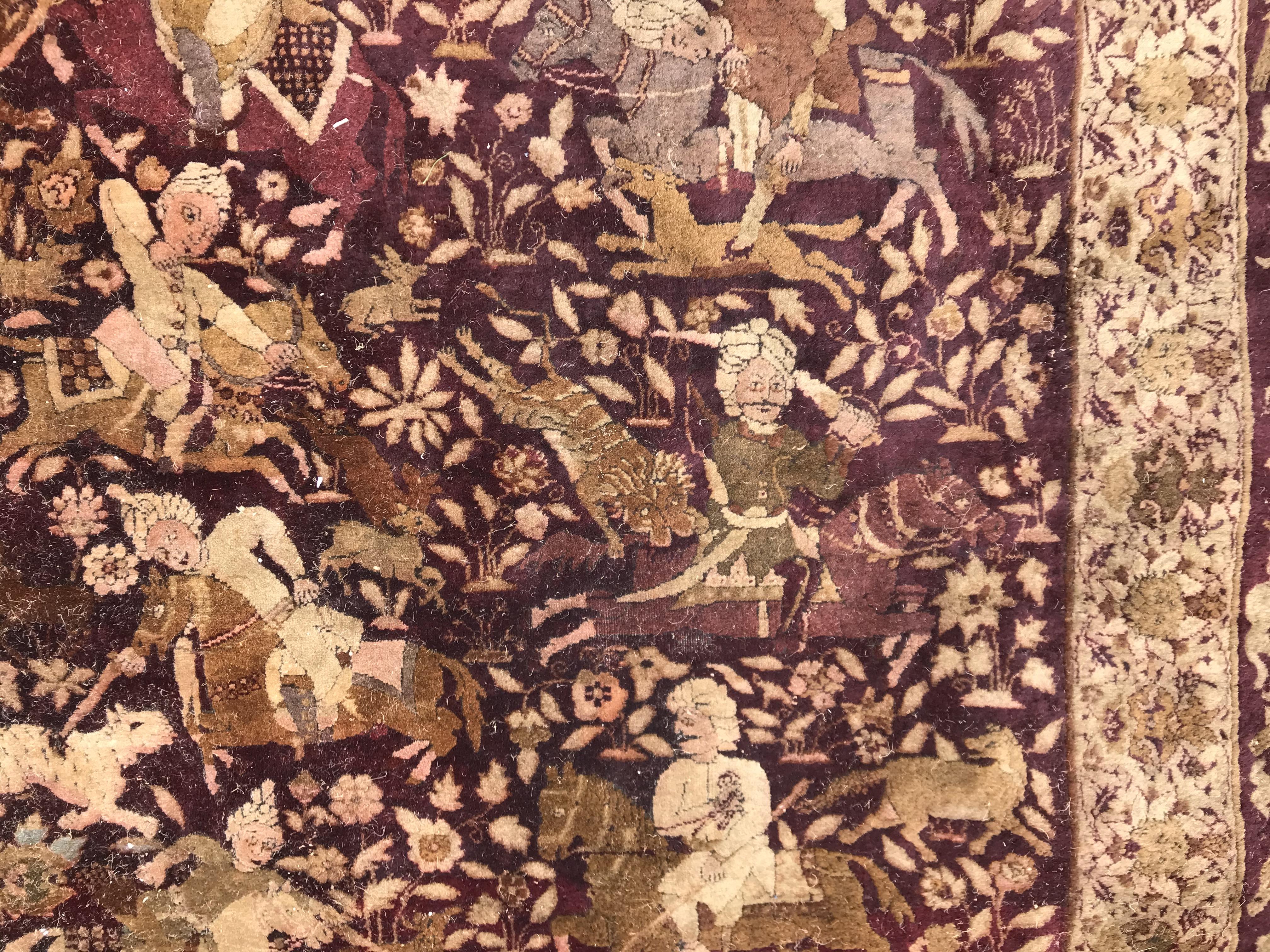 An early 20th Century Agra North India carpet with centre medallion on a wine-coloured ground, - Image 52 of 103