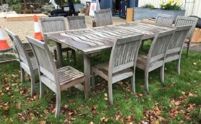 A modern teak rectangular garden table,