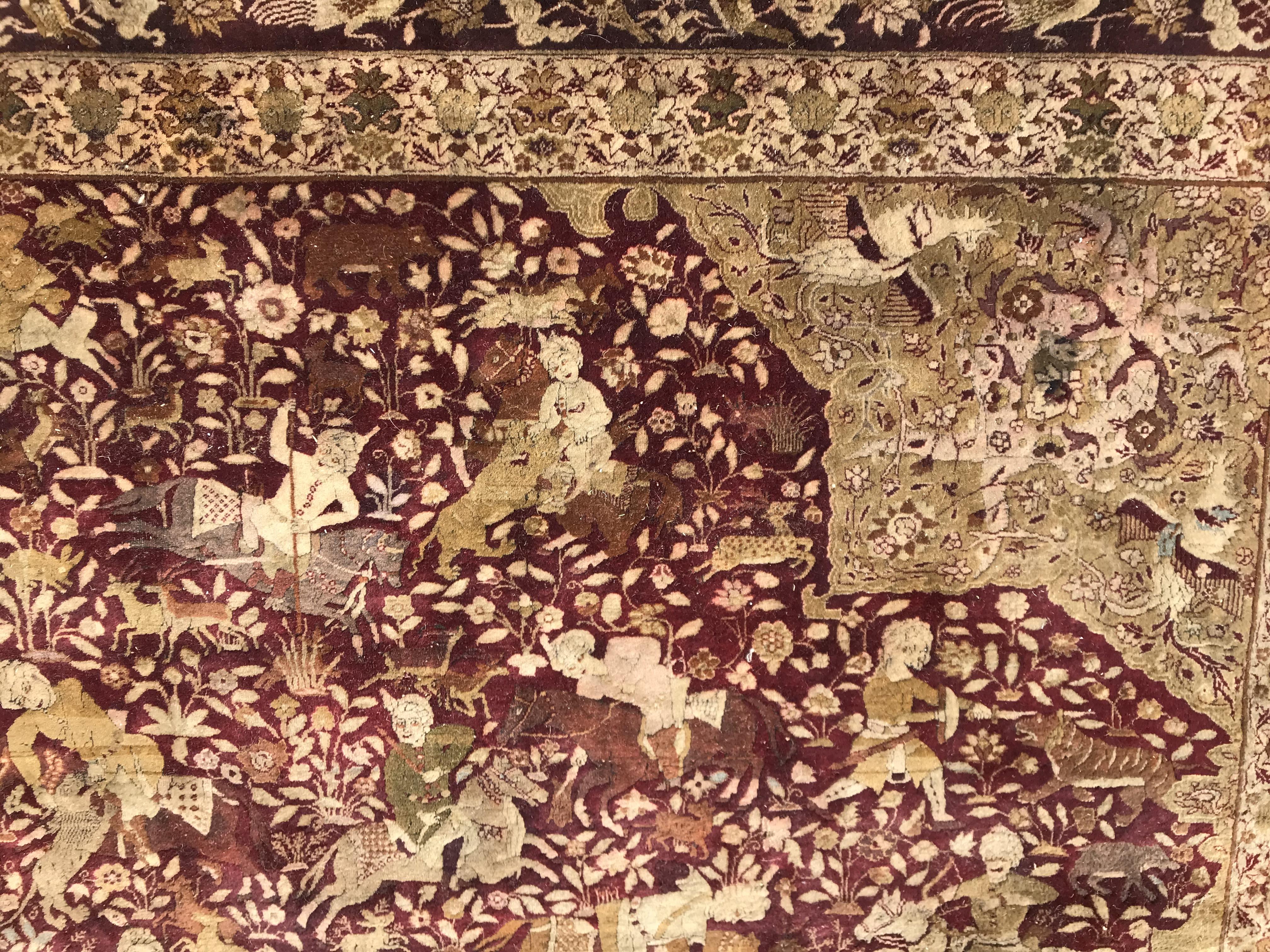 An early 20th Century Agra North India carpet with centre medallion on a wine-coloured ground, - Image 8 of 103