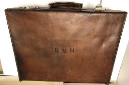 A vintage leather suitcase initialled "BMH" to top, approx 51 cm long x 17.