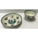 A Caughley tea bowl and saucer circa 1775, polychrome painted in the "Waiting Chinaman" pattern,