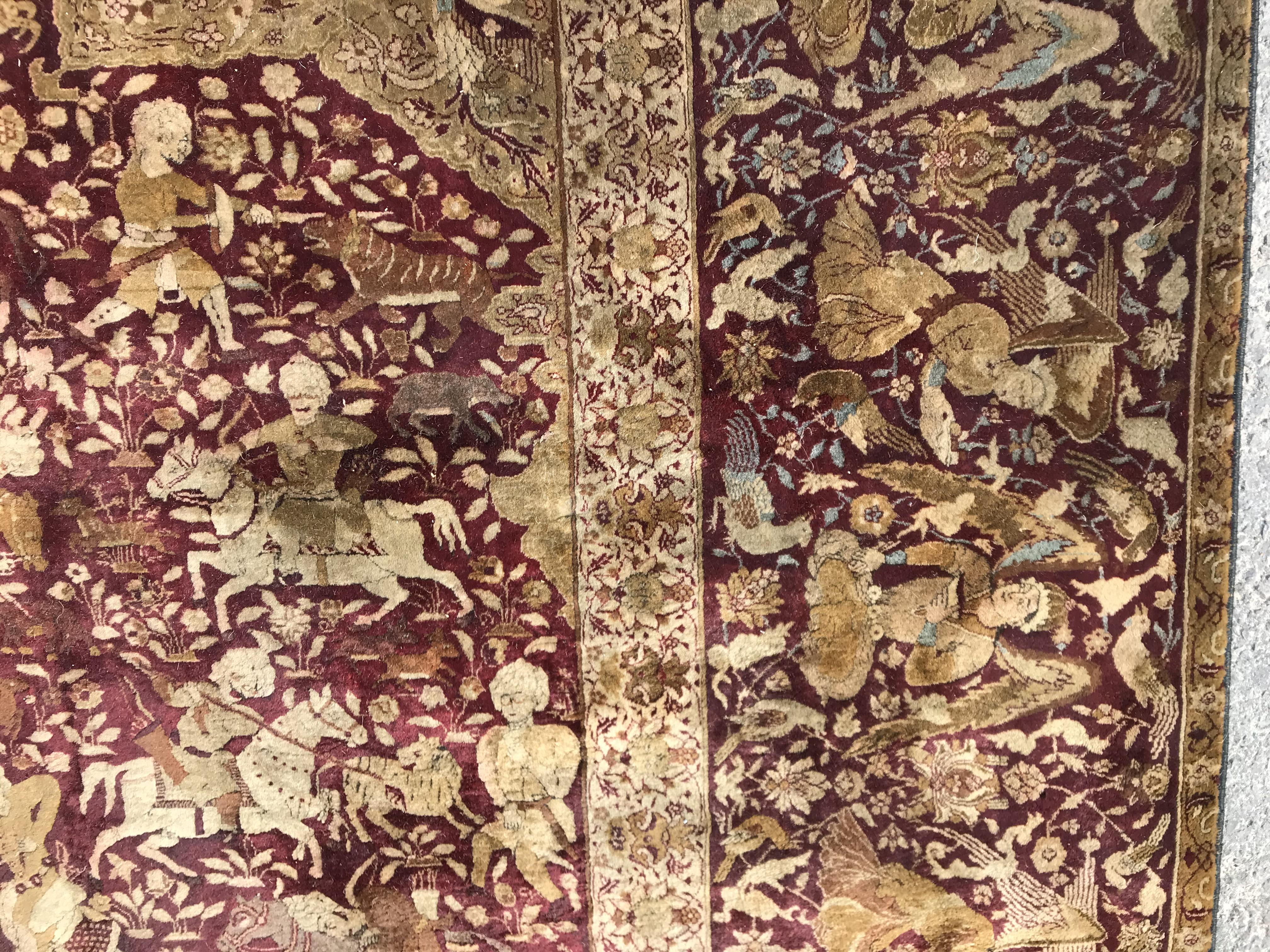 An early 20th Century Agra North India carpet with centre medallion on a wine-coloured ground, - Image 6 of 103