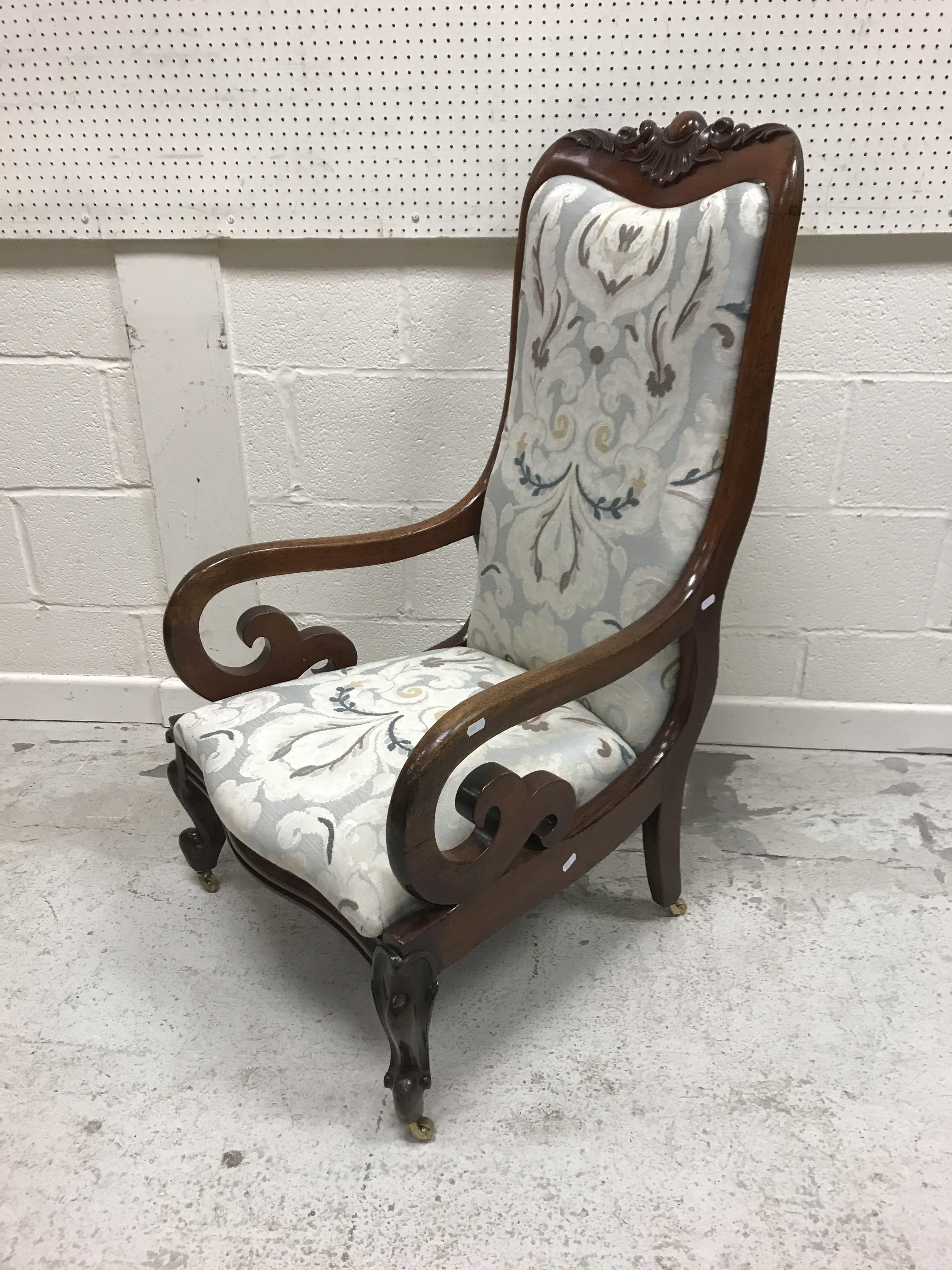 A Victorian mahogany framed scroll arm chair with foliate carved top rail over an upholstered back - Image 2 of 2