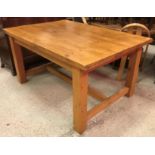 A modern pine farmhouse style kitchen table,