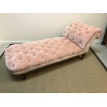 A Victorian pink velour upholstered and buttoned day bed by Howard & Sons of Berners Street, London,