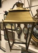 A pair of gold-painted metal and glazed hall lanterns or exterior lanterns of square tapering form,