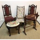 A pair of Carolean style carved oak dining chairs on bobbin supports with upholstered back panel