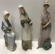 A collection of Lladro figurines to include "Girl with lamb in one hand and basket of onions in the