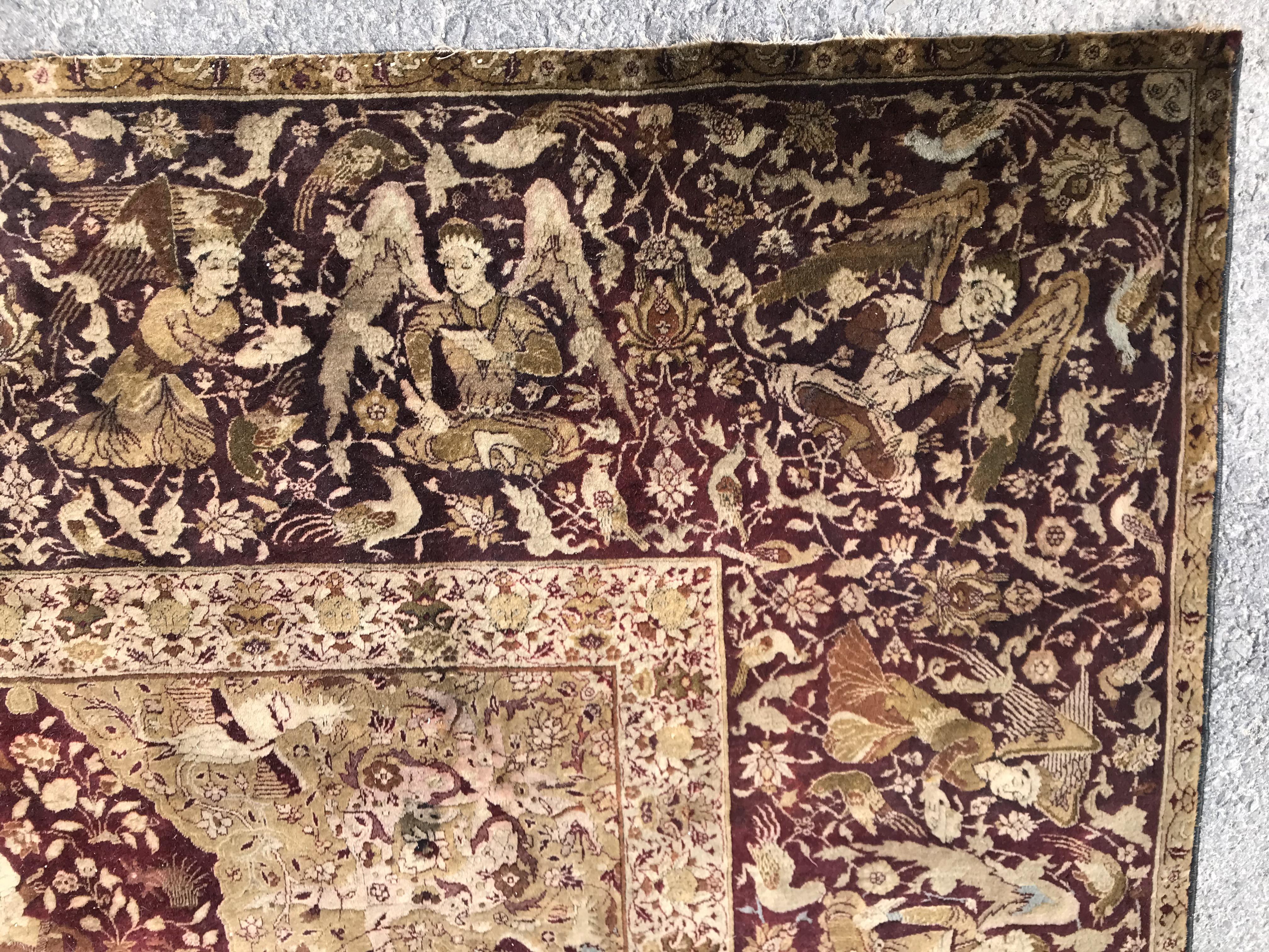 An early 20th Century Agra North India carpet with centre medallion on a wine-coloured ground, - Image 10 of 103