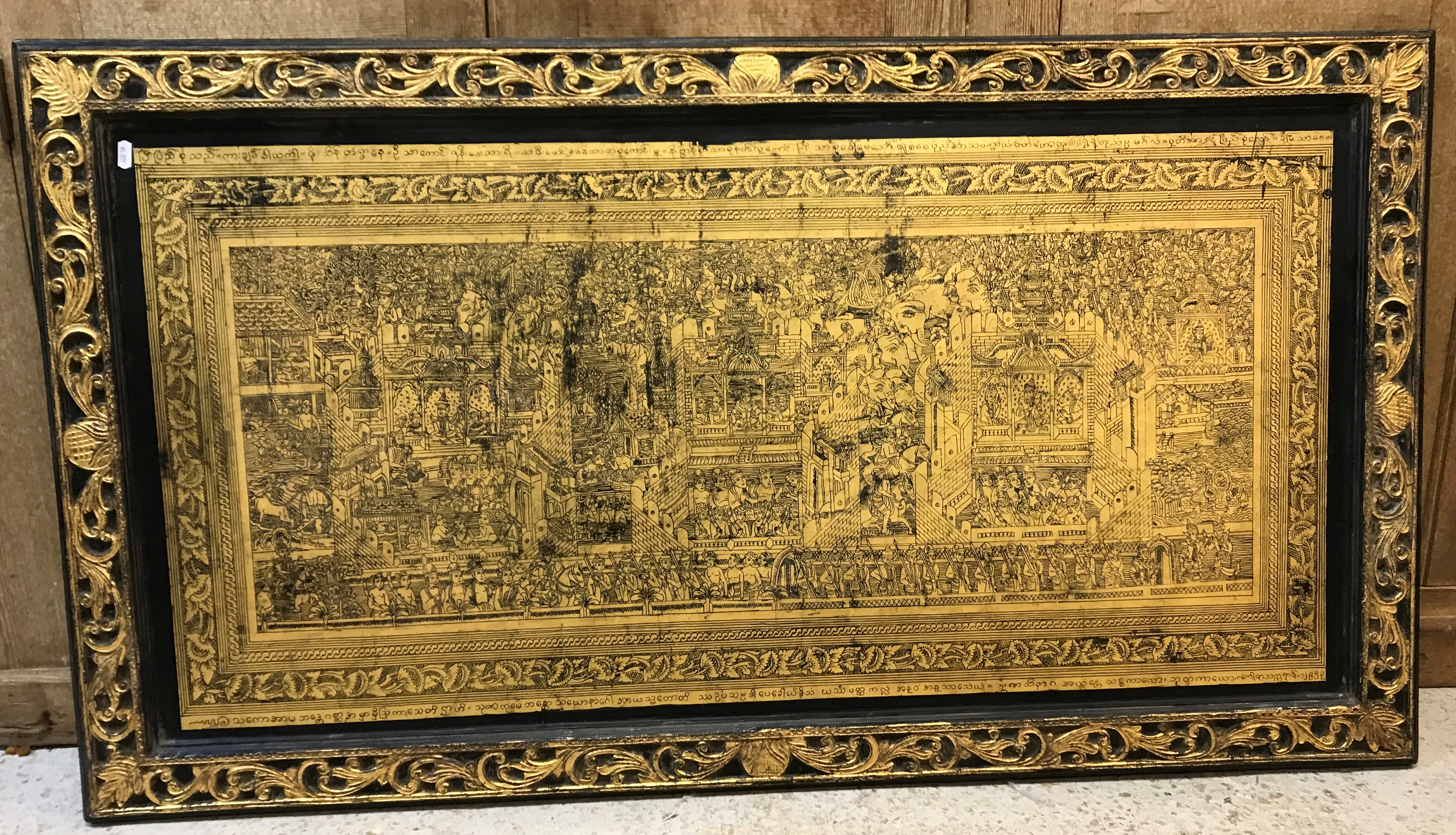 A modern Indonesian ebonised and gilt-decorated wall panel,