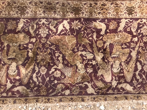 An early 20th Century Agra North India carpet with centre medallion on a wine-coloured ground, - Image 83 of 103