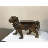 A black forest low stool in the form of a dog set with glass eyes,