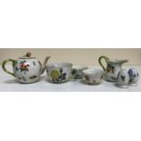 A collection of Herend porcelain tea wares comprising two hot water jugs with lids,