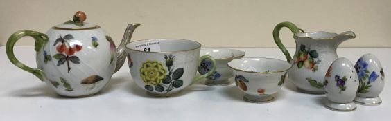 A collection of Herend porcelain tea wares comprising two hot water jugs with lids,