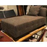 A modern upholstered day bed in dark brown fleck, raised on square block feet, 157.