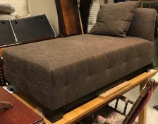 A modern upholstered day bed in dark brown fleck, raised on square block feet, 157.