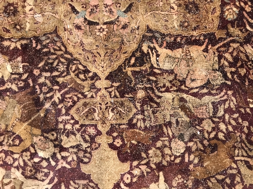 An early 20th Century Agra North India carpet with centre medallion on a wine-coloured ground, - Image 54 of 103