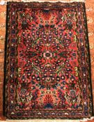 A Sarouk rug, the central panel set with