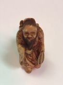 A Japanese Meiji Period netsuke as a bea