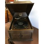 An HMV oak-cased table top gramophone wi