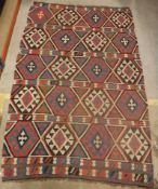 A Caucasian Kelim carpet in blue and pin