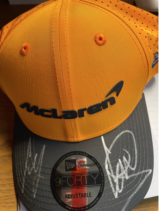 Mc Laren F1. Official replica Drivers Cap, signed by the 2020 drivers Carlos Sainz & Lando Norris.
