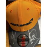 Mc Laren F1. Official replica Drivers Cap, signed by the 2020 drivers Carlos Sainz & Lando Norris.