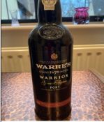 A bottle of Highland Single Malt 12 years. A bottle of Warres 1670 Warrior Port.