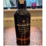 A bottle of Highland Single Malt 12 years. A bottle of Warres 1670 Warrior Port.